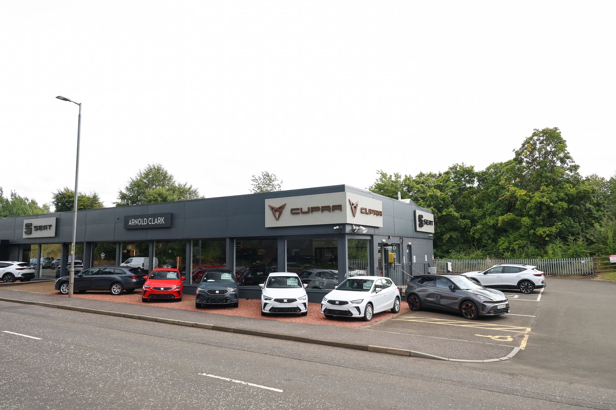 What does Arnold Clark’s takeover of the 65‑year‑old W Livingstone SEAT/CUPRA dealer mean for customers?
