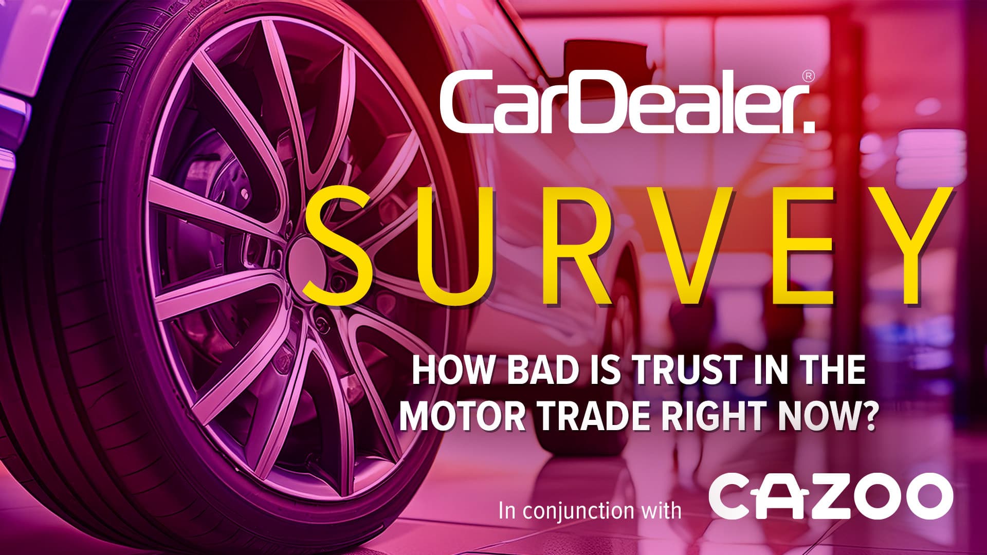 dealer filling online trust survey on a laptop with a smartphone beside it