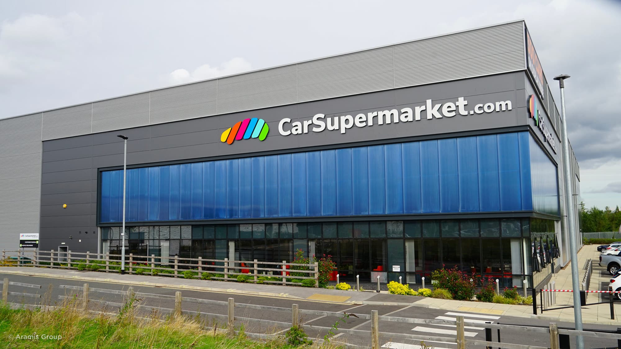 How did CarSupermarket.com achieve a 73% profit surge in 2025?