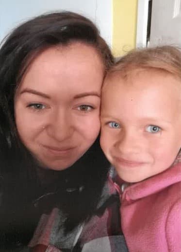 Justyna Hulboj and her daughter Lena standing near the Leeds Jaguar showroom