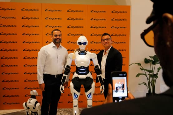 Humanoid Mornine robot and quadruped Argos robot from Chery displayed in a dealership showroom