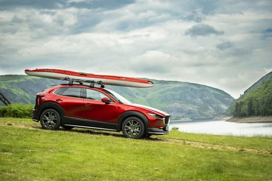 Mazda showroom displaying a selection of vehicle accessories such as roof racks and interior fittings