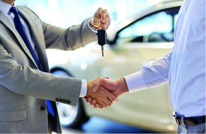 Cazoo research team presenting survey results on used‑car buyer confidence at a dealership