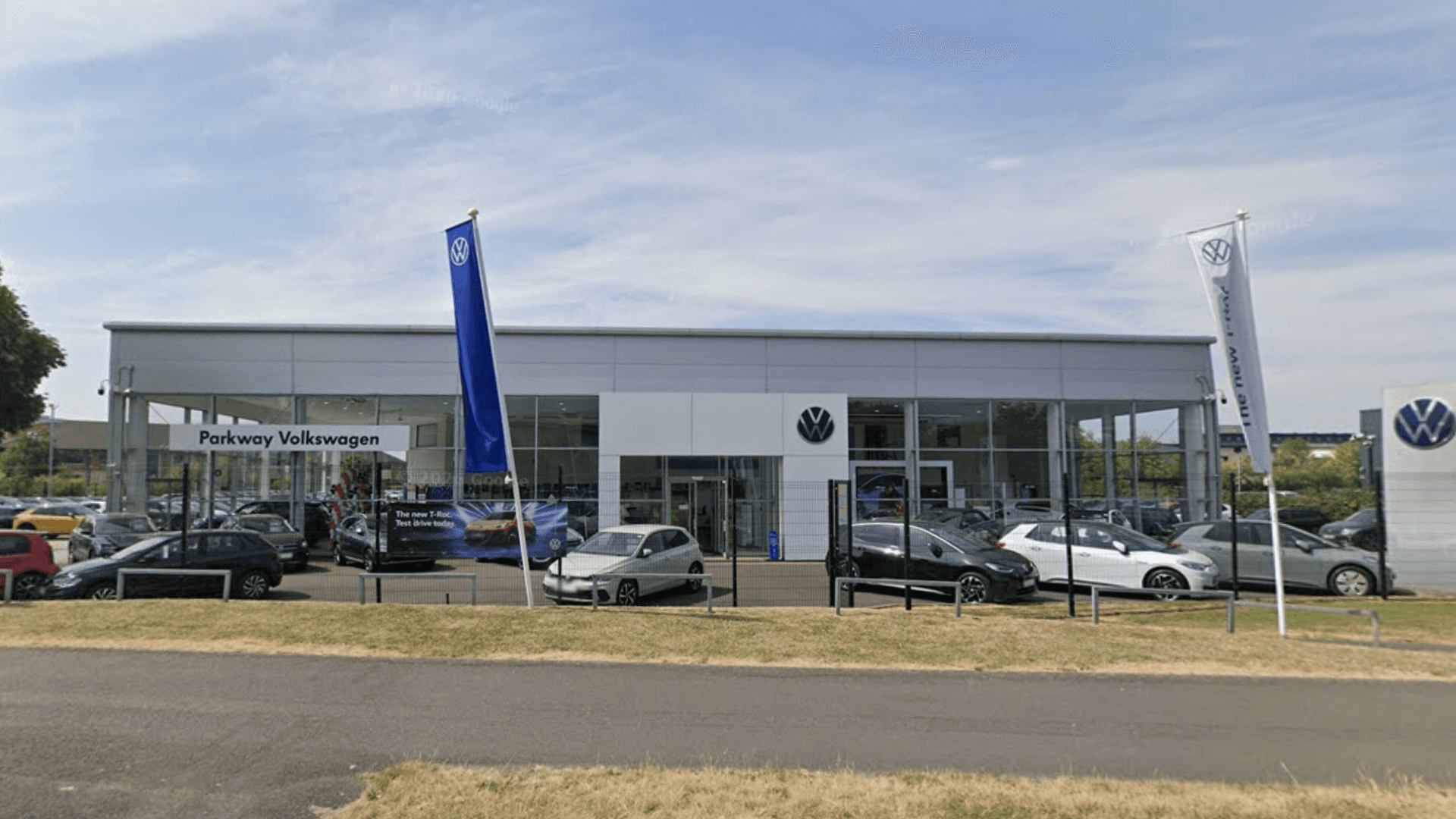 Volkswagen dealership interior with showroom floor and vehicles