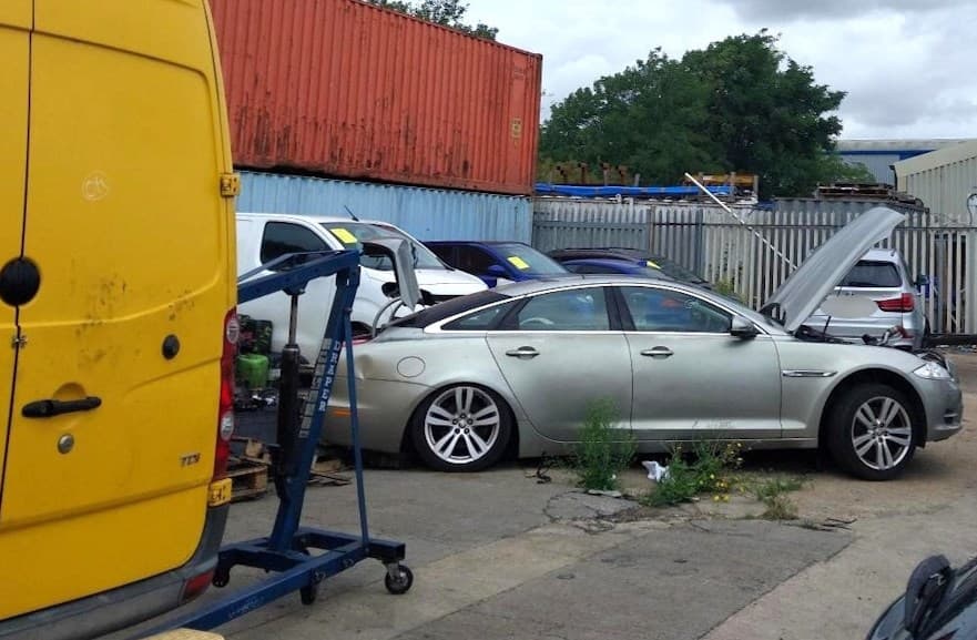 Rows of cars and vans parked on an Essex industrial estate during police raid