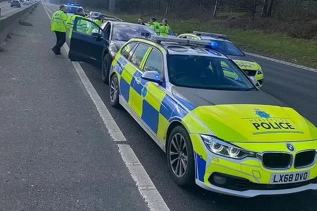 Police officers inspecting recovered stolen vehicles during the nationwide crackdown