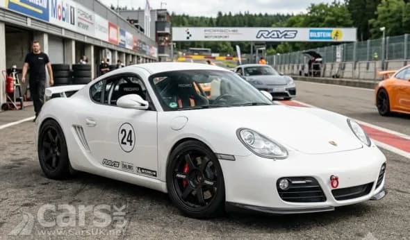 Porsche Cayman mid‑engine sports car on a race track