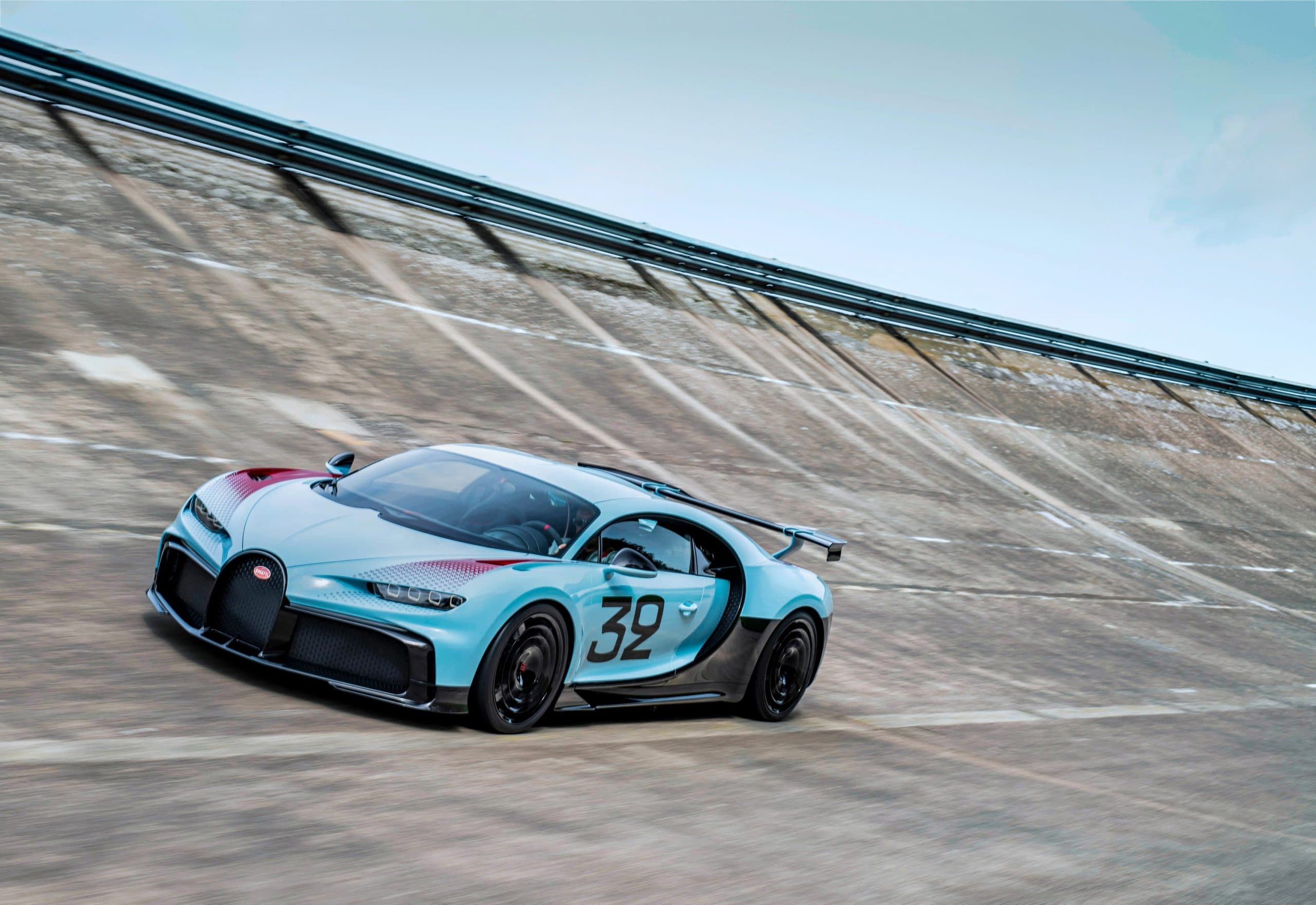 Porsche and Bugatti logos side by side representing the stake sale to Rimac-led consortium