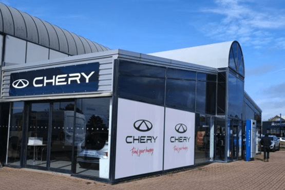 showroom frontage displaying multiple brand logos after expansion