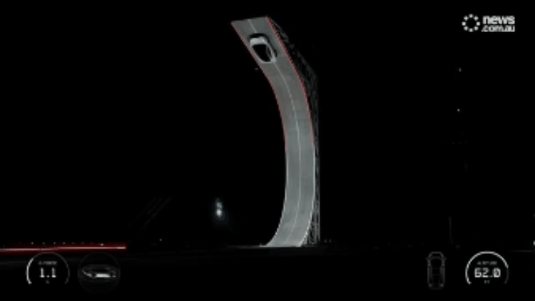 Tesla Roadster performing loop-the-loop stunt with thrusters