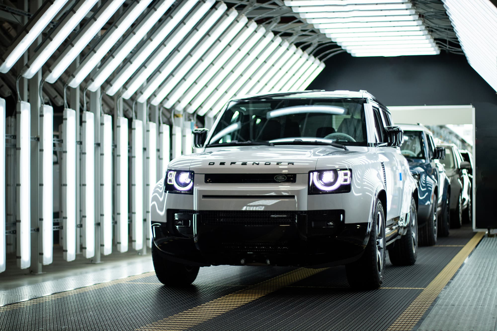 Jaguar Land Rover factory with assembly line and vehicles