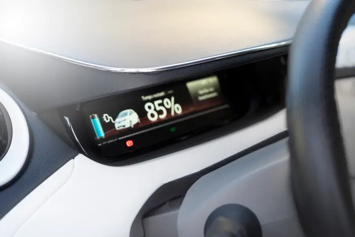 used electric car displayed in dealership with range information