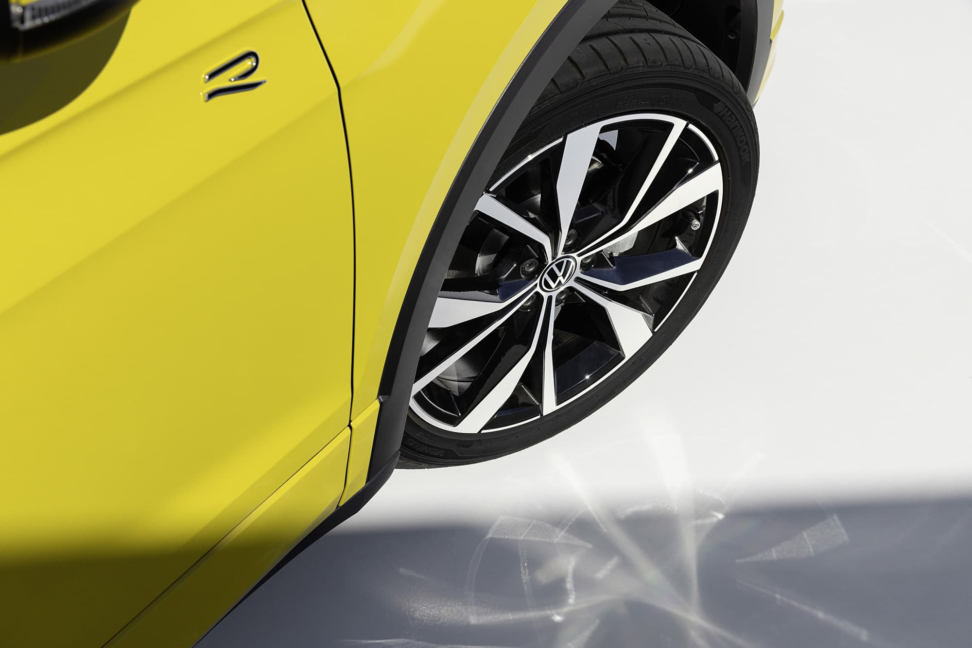 Volkswagen Group logo with financial decline chart